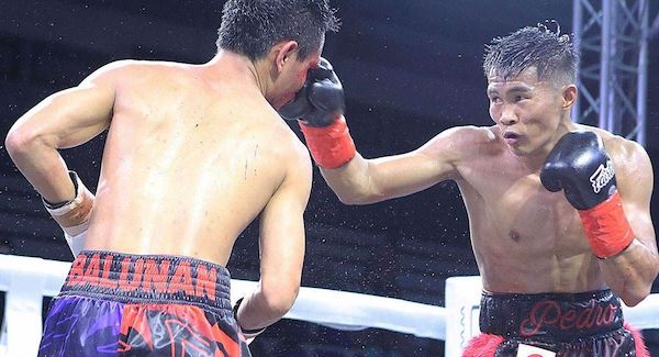 Pedro Taduran retiene su faja tras vencer a Christian Balunan.